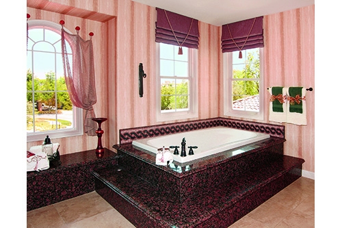 Melissa Bathroom with a white tub incased in a reddish pink marble
